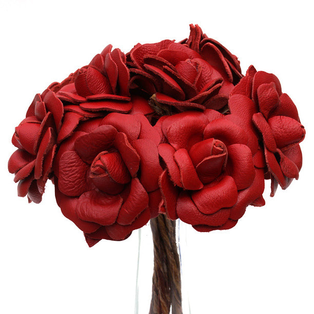 Bouquet of red leather roses as leather anniversary gift on a white background