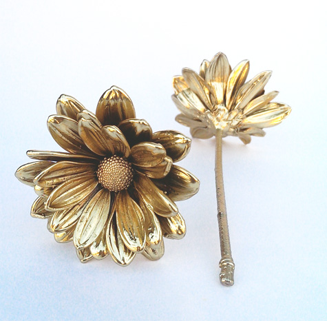 Gold covered real daisies
