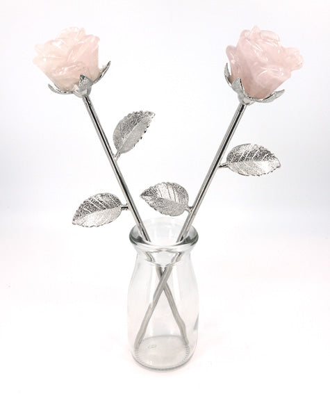 pair of carved rose quartz flowers in vase