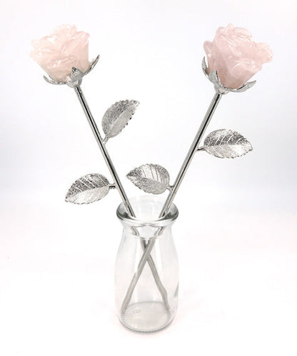 pair of carved rose quartz flowers in vase